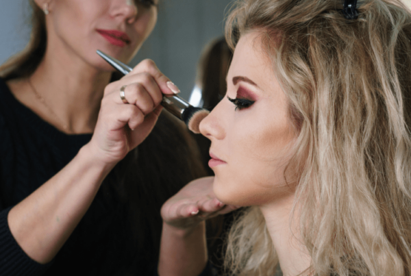 online makeup school student apply makeup on model