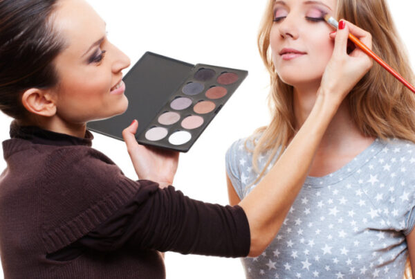 professional makeup artist with client