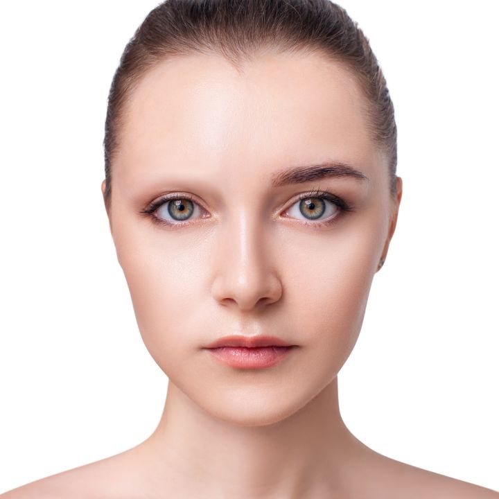 Model with one eyebrow covered and one natural, showing how to cover eyebrows for special FX makeup.