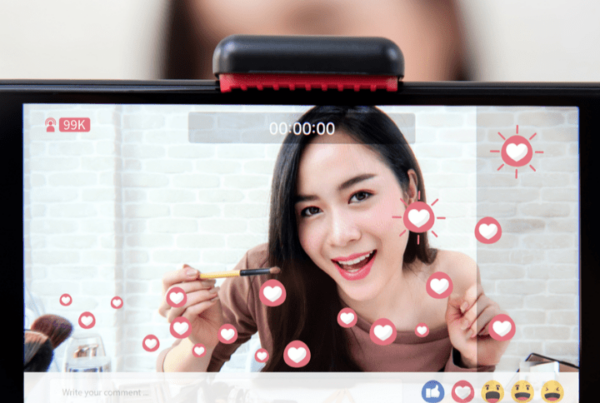 asian beauty vlogger on screen in foreground