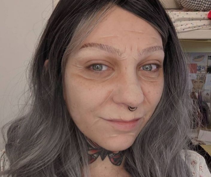 Easy Halloween makeup idea featuring realistic old-age special effects with painted wrinkles, gray hair, and subtle detailing for a convincing transformation.