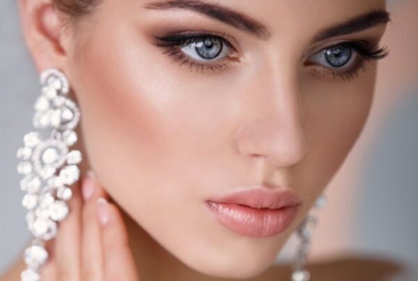 Elegant bride with flawless makeup featuring soft contouring, nude lips, and shimmering eyeshadow — perfect inspiration for bride makeup ideas and modern glitter bridal makeup looks.