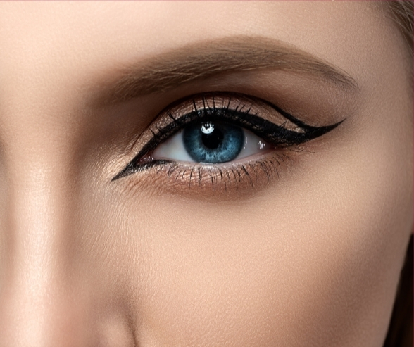 Close-up of elegant winged eyeliner and soft shimmer eyeshadow, showcasing modern bride makeup ideas for a chic wedding look.