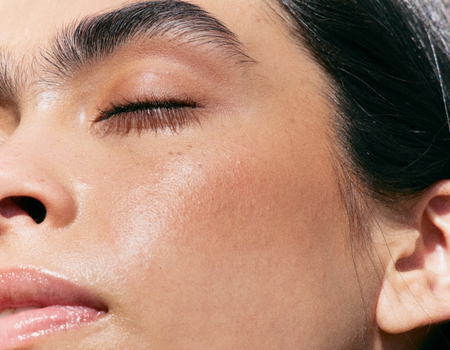 Close-up of dewy skin makeup highlighting natural glow and even complexion