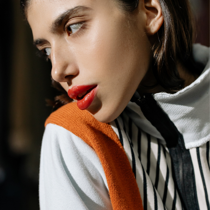 Editorial coral lipstick makeup look with clean skin finish