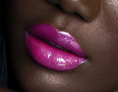 Glossy magenta lipstick showcasing bold lip color and shine