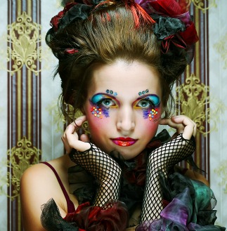 Model with makeup, hair, and outfit styled like a doll