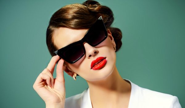 Woman wearing sunglasses and red lipstick