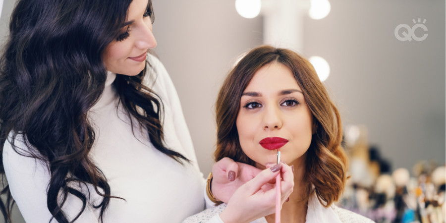 professional makeup artist training applying glam makeup on makeup model