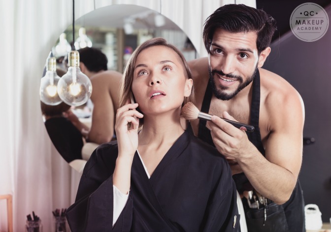 client on the phone during makeup application