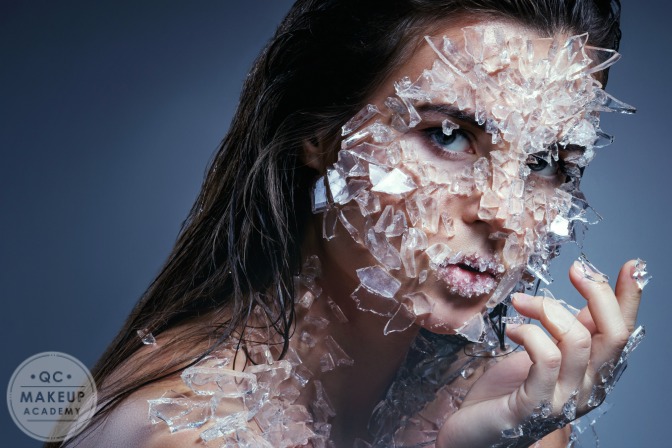 special effects makeup with girl covered in glass shards 