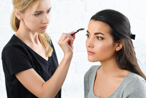 professional makeup artist working on a client