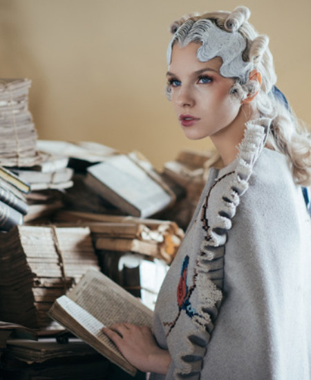 Girl looking off with book in her hands Hair and concept Dan Stoica - Photography Adriana Becichi Makeup by Adela Simpalean