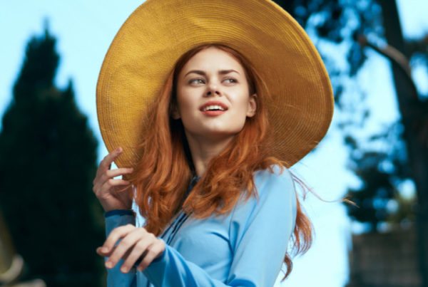 fashion styling course leads to successful fashion career - red head girl blue dress sun hat on