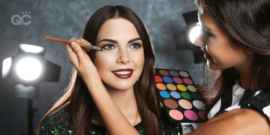 makeup artist applying makeup to client