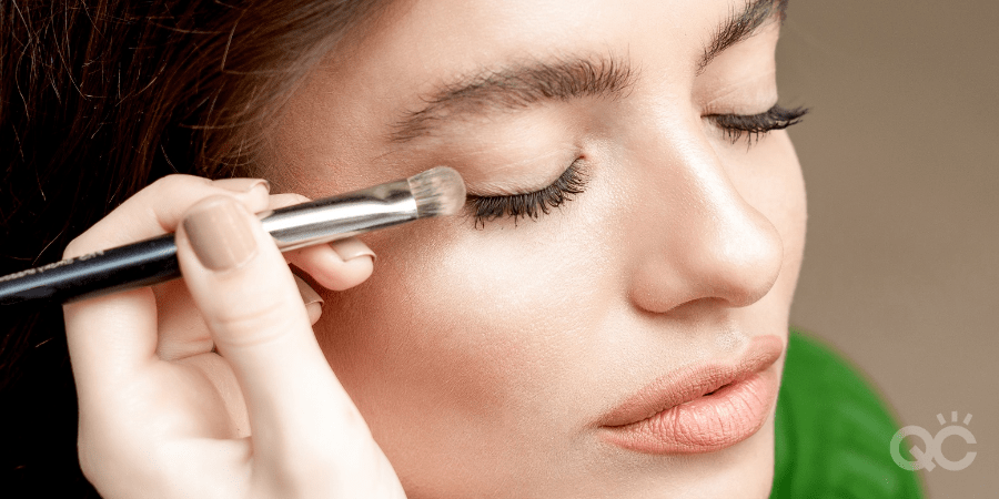 makeup artist training - putting eyeshadow on client