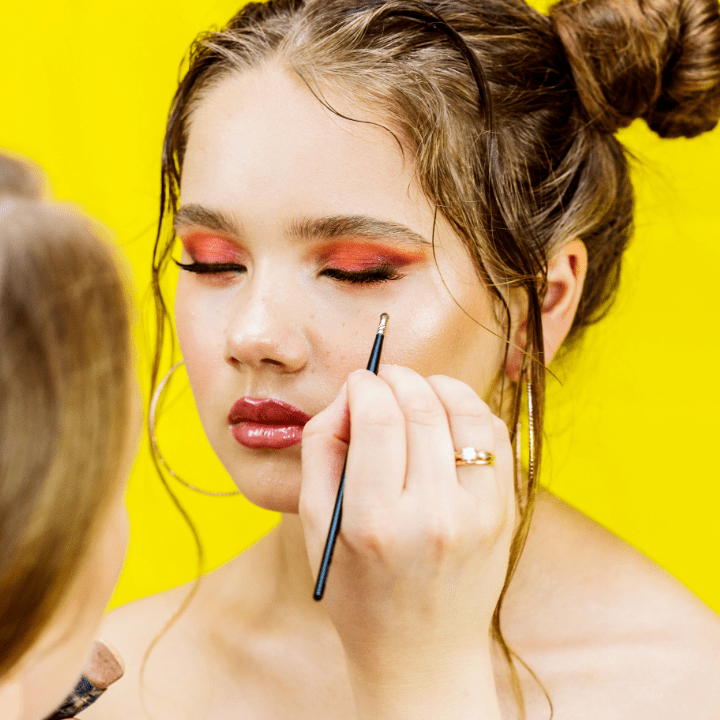 makeup artistry professional putting makeup on model