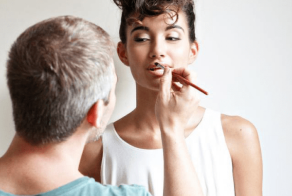 QC makeup classes instructor, Nathan Johnson, doing makeup on female model