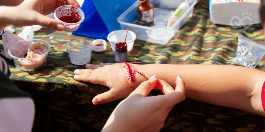 makeup jobs - makeup artist creating fake wound on child's arm